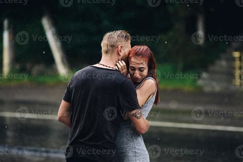 beautiful couple hugging in the rain 11340410 Stock Photo at Vecteezy