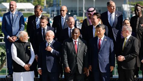 G20 leaders take group shot without Biden