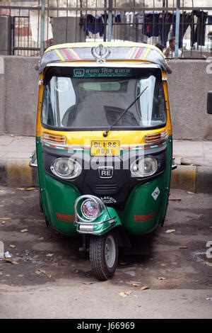 Yellow And Green Auto Rickshaw On Street Of Ahmedabad Gujarat India