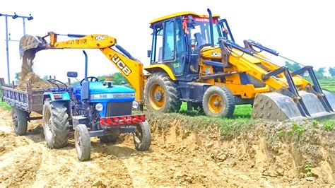 New Jcb Dx Backhoe Loader Machine Loading Stone In Old Sonalika Di