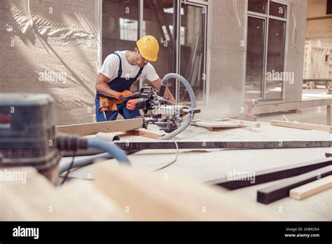 Male Worker Using Wood Cutting Circular Saw Machine Stock Photo Alamy