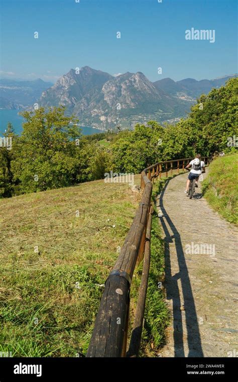 Mountain Biker Heading Down The Hiking Route From Santuario Della