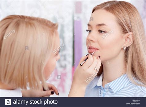 Blonde Professional Makeup Artist Making Permanent Makeup Of Lips For Client Cosmetologist