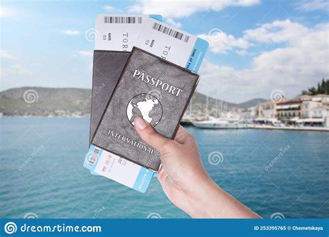 Woman Holding International Passports With Boarding Passes And