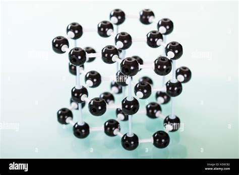 Model Of Graphite Molecular Structure On Green Reflective Background