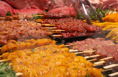 Premium Photo | Showcase with a variety of raw meat dishes