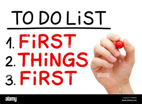 Hand Writing First Things First In To Do List With Red Marker Isolated