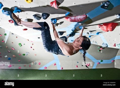 climber bouldering at indoor climbing wall in London Stock Photo - Alamy