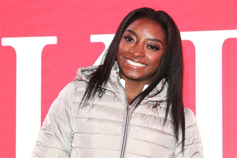 Simone Biles Strikes a Pose in Crop Top, Leggings & White Sneakers ...