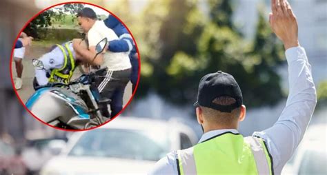 Video de pelea entre agente de tránsito y motociclista en retén en vía