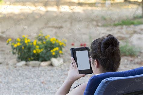Reading In A Tablet Outdoors People Images Creative Market