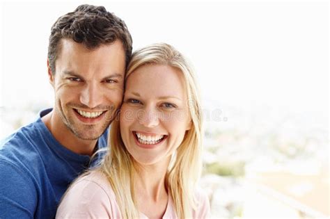 Sharing Matching Smiles Of Love And Contentment A Happy Young Couple