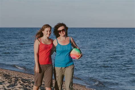 Cute Mommy And Adult Daughter Stand On Seashore Stock Image Image Of