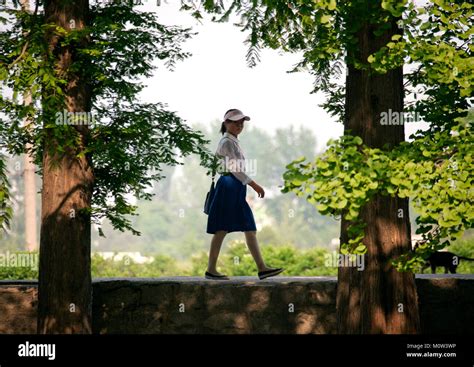 North Korean Teenage Girl Walking In A Park North Hwanghae Province