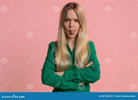 Cheerful Funny Bully Young Woman Showing Tongue Making Silly Faces