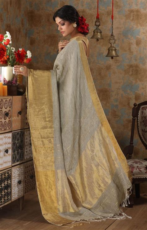 Sage Green Organic Textured Linen Saree With A Striking Gold Zari Border And Pallu Bollywood