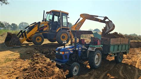 Jcb Dx Backhoe Machine Loading Mud In Trolly Eicher And Massey Tractor