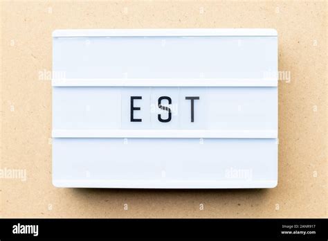 White lightbox with word est (abbreviation of established, estimated ...