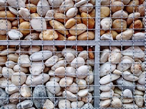 Premium Photo | Full frame background of decorative pebble stones wall