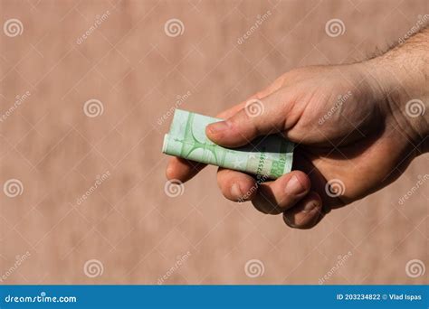 Man Hands Giving Money Like A Bribe Or Tips Holding EURO Banknotes On