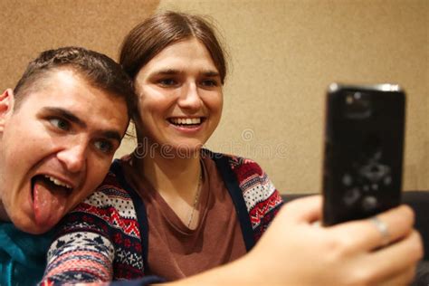 Defocus Young Man And Woman Taking Selfie Couple Or Friends Laughing