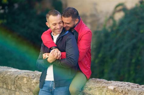 Premium Photo Smiling Gay Couple Embracing Outdoors