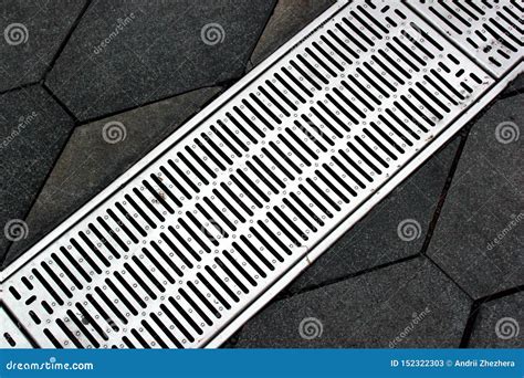 Street Gutter Of A Stormwater Drainage System On A Sidewalk Stock Image