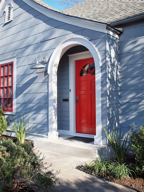 blue house white trim red door - Jacklyn Stjohn