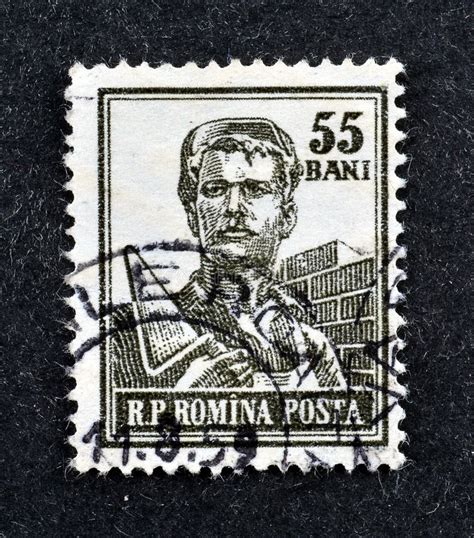 Cancelled Postage Stamp Printed By Romania That Shows Bricklayer