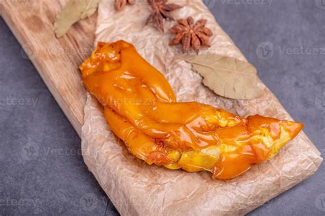 Stewed Yellow Pig Feet In Bamboo Containers Against A Dark Background