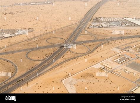 Aerial Day View Of A Highway With An Elevated Interchange In A Desert