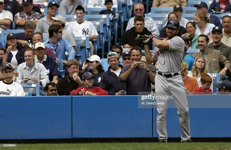 Outfielder Johnny Damon Of The Boston Red Sox Prepares To Bat Against