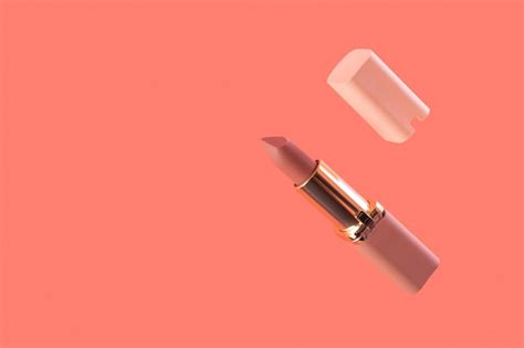 Premium Photo Levitation Nude Matte Lipstick And Cap On A Pink Background In A Pink And Gold