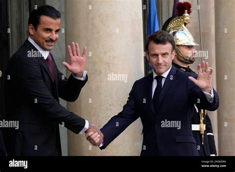 French President Emmanuel Macron Right Poses With The Emir Of Qatar