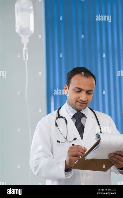 Doctor Writing On A Notepad Stock Photo Alamy