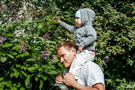 Baby One Year Old Sitting On Dad`s Neck Stock Image Image Of Infant