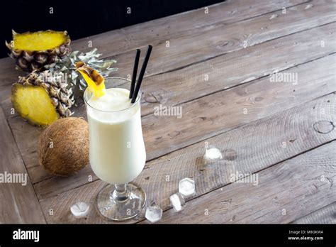 Pina Colada Cocktail With Pineapple And Coconut Over Wooden Background Copy Space Summer