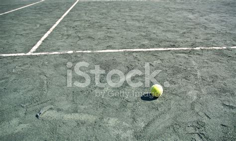 Green Clay Tennis Court With Ball and White Boundary Lines stock photos ...