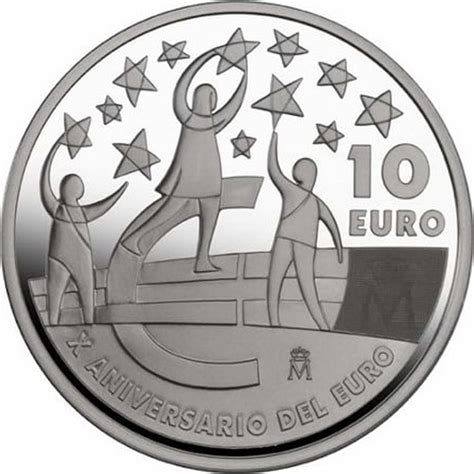 A Silver Coin With An Image Of Two People Holding Hands And The Words