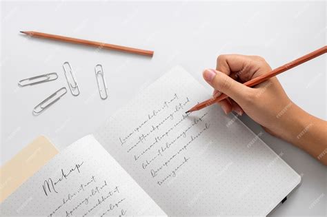 Premium Psd View Of Person Writing On Paper With Pencil