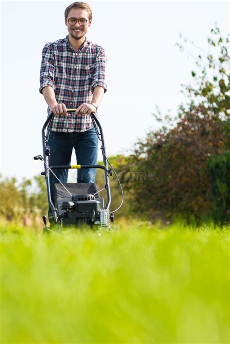 Young Man Mowing The Grass Stock Image Image Of Maintenance 78566391