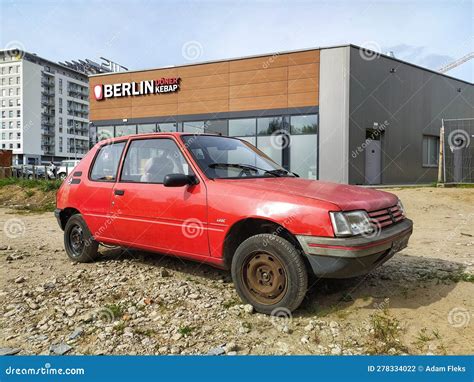 Old Classic Rusty Small Compact Car Peugeot 205 From Eighties Parked