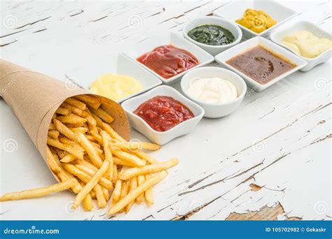 French Fries With Sauces On White Background Top View Stock Photo