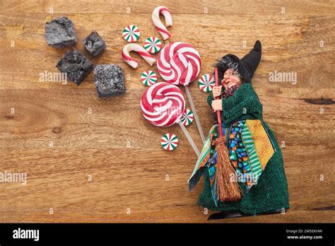 The Befana with sweet coal and candy. Italian Epiphany day tradition ...