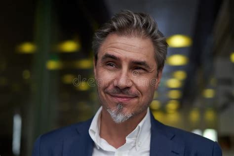 Portrait Of Happy Mature Man Smiling And Looking At Camera Confident