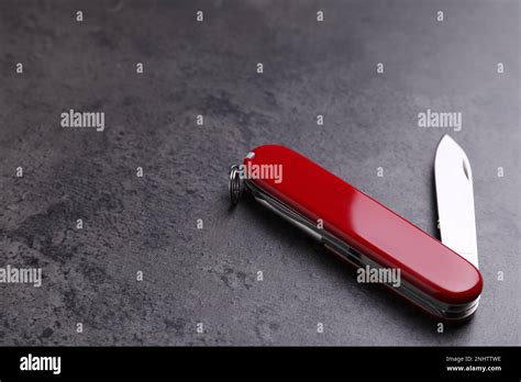 Modern Compact Portable Multitool On Grey Table Space For Text Stock