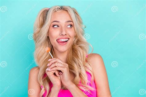 Photo Of Young Girl Happy Positive Smile Hold Lollipop Sweet Lick Teeth