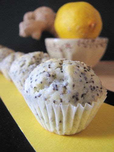 Two Muffins Sitting On Top Of A Yellow Counter