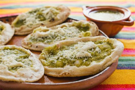 Mexican Sopes with Grated Cheese and Green Salsa, Mexican Food Spicy in Mexico Stock Image ...