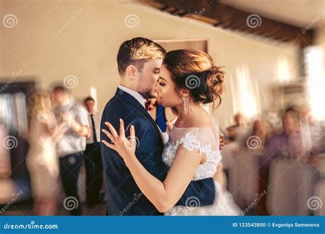 The Bridegroom Embraces The Bride During The Wedding Dance Stock Photo